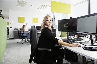 Marija sitting in the office at her desk