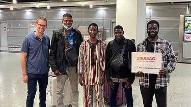 Evariste (right) on his arrival in Germany