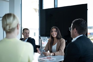 4 colleagues in a meeting room