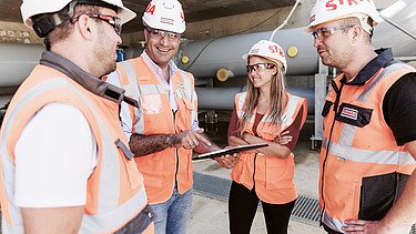 Aykut with his team on the construction site