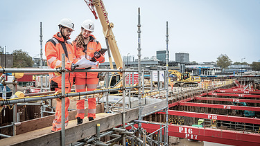 Two colleagues in conversation together at the workplace