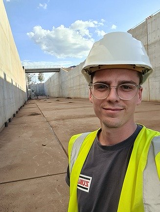 Selfie of young man with construction helmet