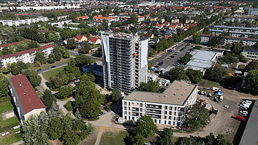 The blue high-rise building during refurbishment