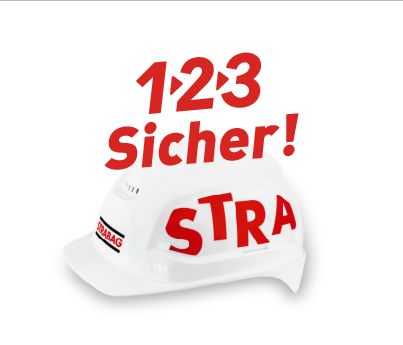 Ein weisser Helm mit STRABAG Logo und darüber der Schriftzug 1-2.3 Sicher! 