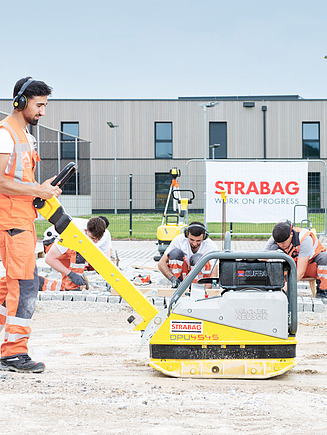 Trainee driving a roller.